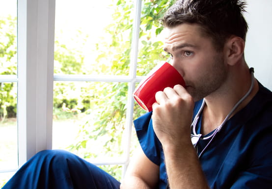 Man drinking from a mug